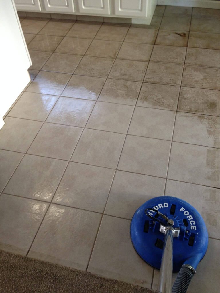 Dark grout before and after professional cleaning