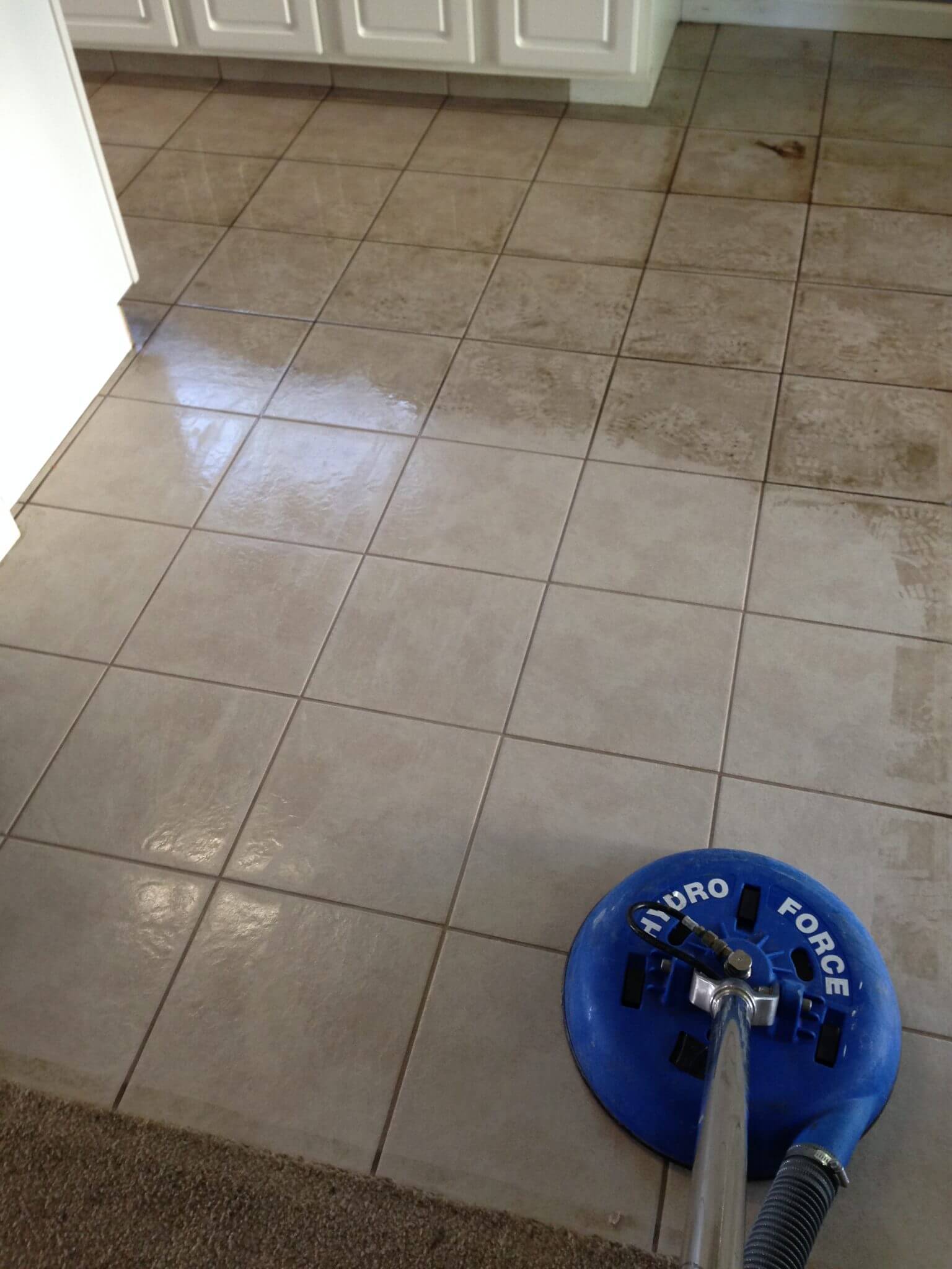 Dark grout before and after professional cleaning